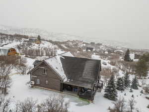 Snowy aerial view featuring a mountain view