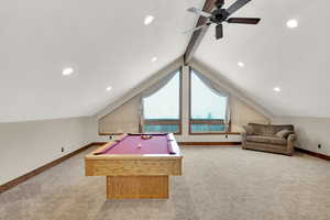 Game room featuring vaulted ceiling with beams, light colored carpet, and pool table