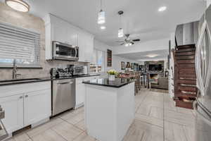 Gourmet kitchen with black quarts counters