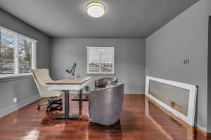 Office area featuring dark hardwood / wood-style floors