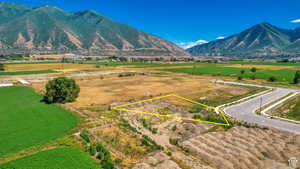 Aerial view featuring a rural view and a mountain view