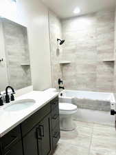 Full guest bathroom on main with upgraded floor to ceiling tile shower and oversized bathtub