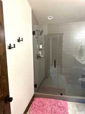 Oversized shower with floor to ceiling tile shower