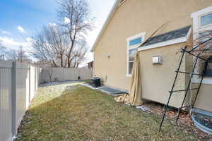 View of yard with central AC