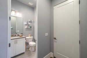 Bathroom with vanity and toilet