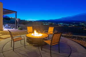 View of patio featuring a mountain view and an outdoor fire pit