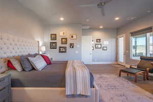 Bedroom with access to exterior, ceiling fan, and light hardwood / wood-style flooring