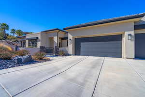 View of front of property featuring a garage