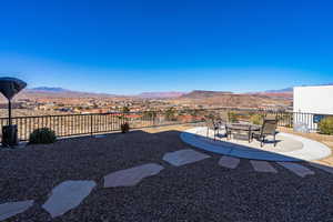 View of yard with a mountain view, a fire pit, and a patio area