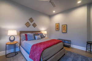 Bedroom featuring hardwood / wood-style flooring and ceiling fan