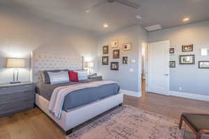 Bedroom with hardwood / wood-style flooring and ceiling fan