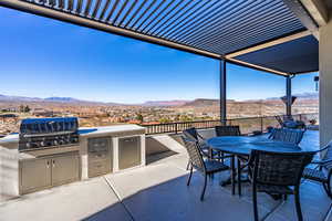 View of patio / terrace featuring a grill, a mountain view, and area for grilling