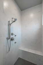 Bathroom featuring a tile shower