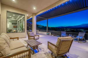 View of patio / terrace with an outdoor living space and a mountain view