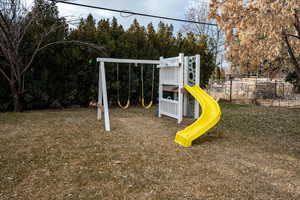 View of playground with a lawn