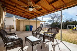 View of patio / terrace featuring a playground, an outdoor hangout area, and ceiling fan