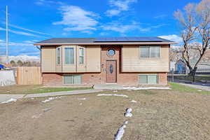 Bi-level home featuring solar panels