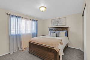 Bedroom featuring carpet flooring