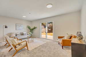 Living room featuring light colored carpet