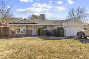 Ranch-style home with a garage