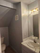 Bathroom featuring lofted ceiling, tile patterned flooring, vanity & new fixtures