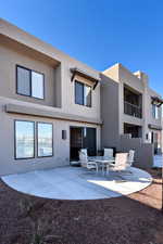 Rear view of property with a patio