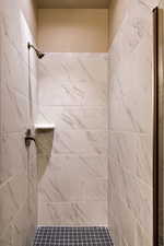 Bathroom with tiled shower