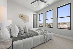 Bedroom with vaulted ceiling, carpet flooring, and ceiling fan