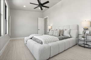 Carpeted bedroom with ceiling fan