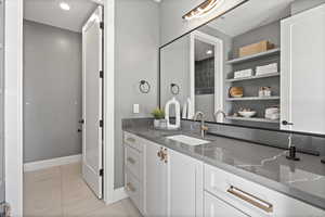 Bathroom with vanity and tile patterned floors