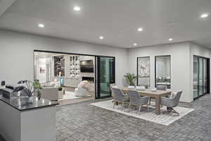 Dining room featuring an outdoor stone fireplace