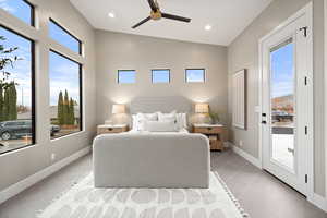 Tiled bedroom with ceiling fan and access to exterior