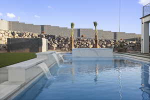 View of pool featuring pool water feature