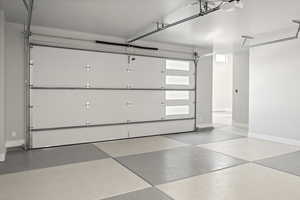 Garage featuring a garage door opener