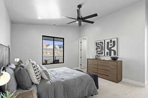 Bedroom featuring light colored carpet and ceiling fan