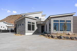 Contemporary house featuring a mountain view