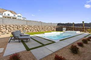 View of swimming pool featuring a patio