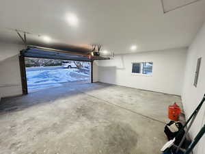 Garage featuring a garage door opener