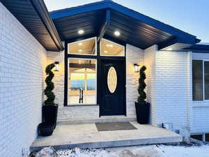 View of snow covered property entrance