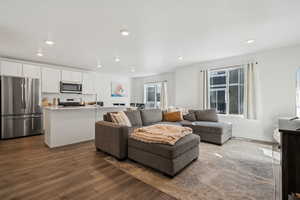 Living room featuring dark hardwood / wood-style flooring