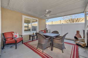 View of patio featuring ceiling fan