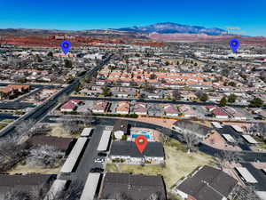 Birds eye view of property featuring a mountain view