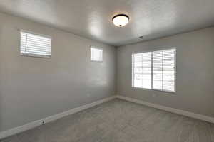 Unfurnished room with carpet floors