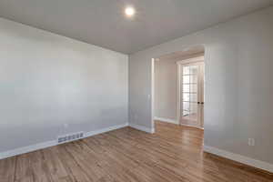 Spare room featuring light wood-type flooring