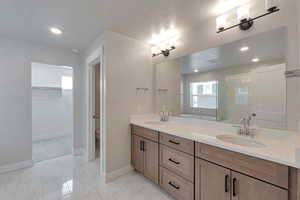 Full bathroom with vanity, independent shower and bath, and toilet