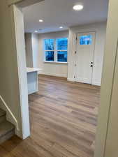 Foyer entrance with light hardwood / wood-style floors