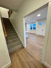 Entrance foyer featuring light hardwood / wood-style floors