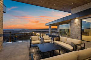 View of patio with a mountain view and an outdoor living space