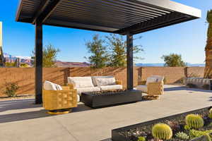 View of patio / terrace featuring outdoor lounge area, a mountain view, a fenced backyard, and a pergola