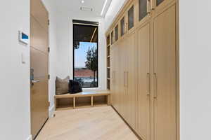 Mudroom featuring light wood-style floors